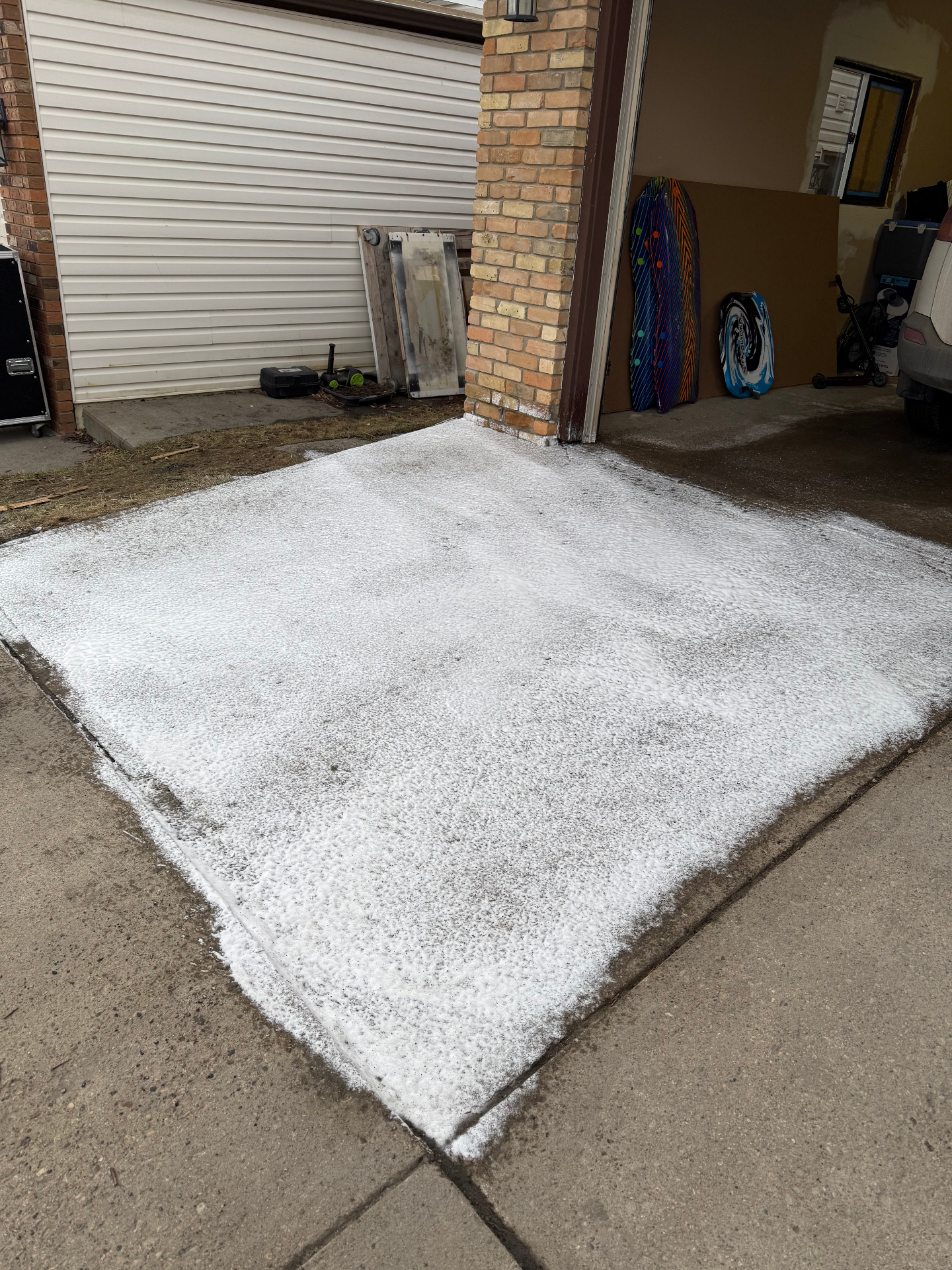 Pressure washing pre-treatment foam on driveway